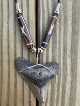 Load image into Gallery viewer, 1 15/16 inch Fossilized Megalodon Shark Tooth Necklace featuring Brown Bones With X Design
