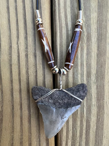 1 15/16 inch Fossilized Megalodon Shark Tooth Necklace featuring Brown Bones With X Design