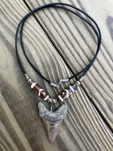 2 inch Fossilized Angustiden Shark Tooth Necklace featuring Brown Bones With Yin and Yang Designs